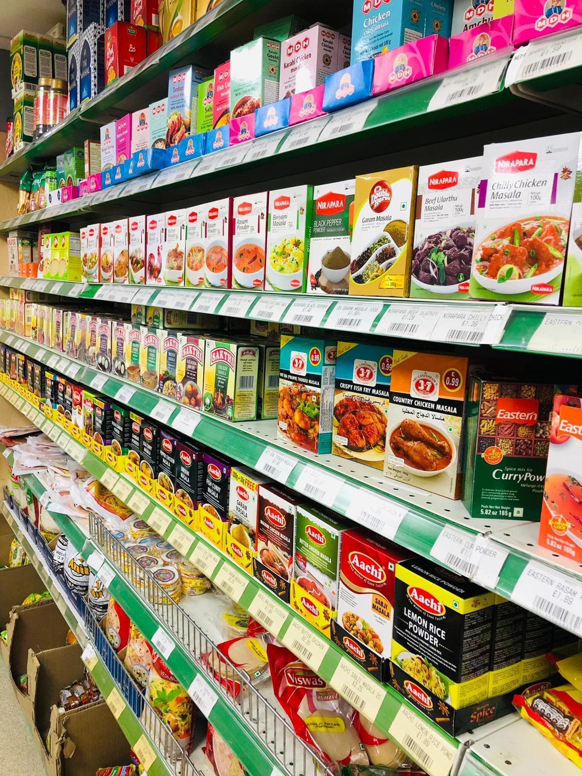 More fresh vegetables neatly arranged in crates outside